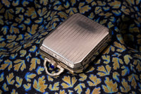 Elgin Art Deco Travel Clock/Pendant - Faceted Rectangular Case - Gilt Perlage Interior – Blue Cabochon Release - Early 1930s