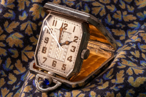 Elgin Art Deco Travel Clock/Pendant - Faceted Rectangular Case - Gilt Perlage Interior – Blue Cabochon Release - Early 1930s
