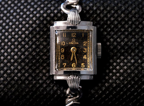 1940s Omega ladies wristwatch black gilt dial Calibre 244 steel vintage watch